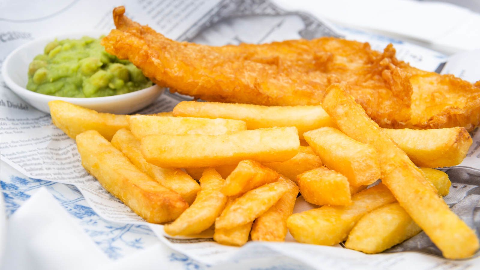 Fresh fish and chips with golden batter and thick-cut chips
